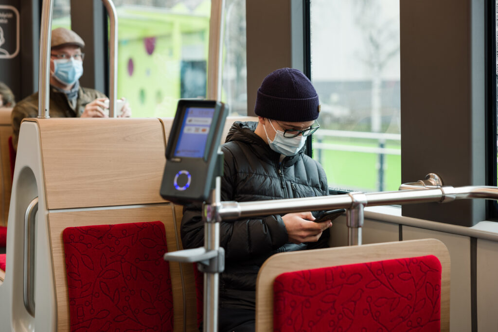 Passengers sitting inside the tram.